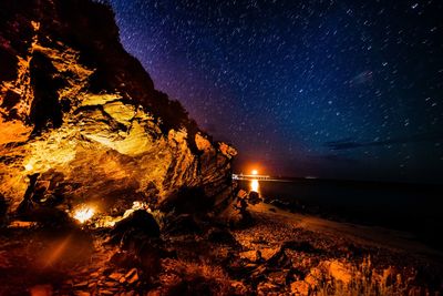 Scenic view of illuminated star field against sky at night