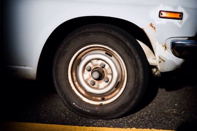 Close-up of car on road