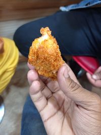 Close-up of hand holding ice cream