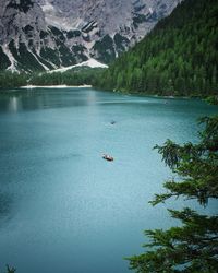 High angle view of boats on lake against mountains