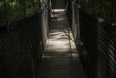 Suspended wooden bridge in nature