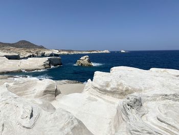 Scenic view of sea against clear blue sky