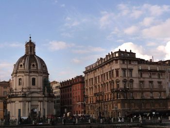 Buildings in city against sky