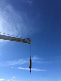 Low angle view of windmill against sky