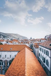 High angle view of buildings in city against sky