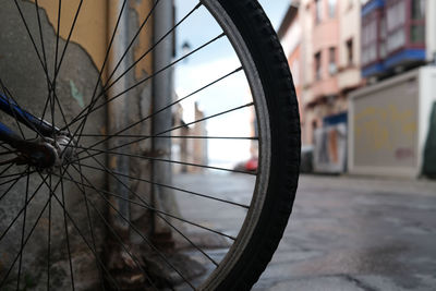 Bike wheel against city
