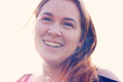 Close-up portrait of a smiling young woman