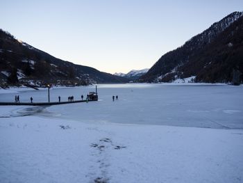 Scenic view of frozen landscape against clear sky