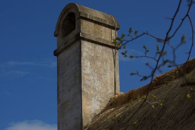 Low angle view of built structure against blue sky