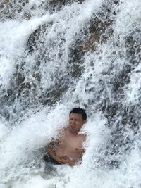 High angle view of man in waterfall
