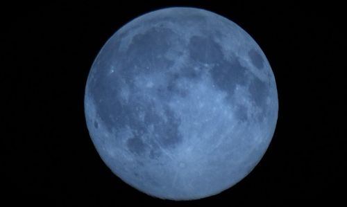 Low angle view of moon in sky