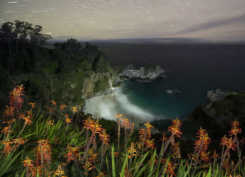 Spinning stars over mcway falls at julia pfeiffer state park, californ