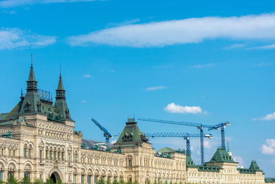 Low angle view of building against cloudy sky