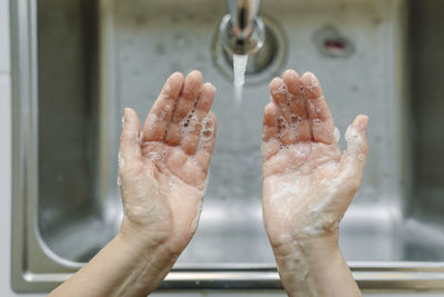 Woman washing her hands