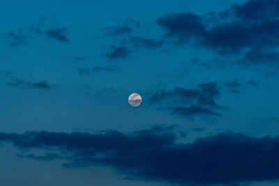 Low angle view of moon against sky at night