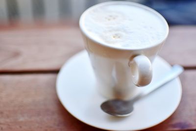 Close-up of latte on wooden table