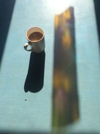 High angle view of coffee cup on table