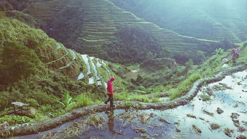 High angle view of man walking on trail against mountains