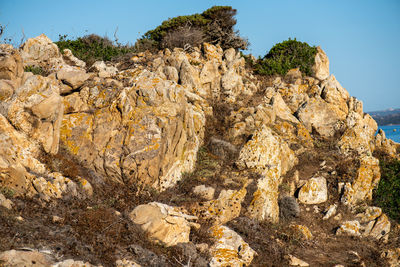 Rock formation on land against sky