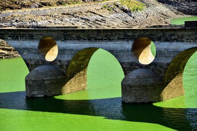 Arch bridge over river