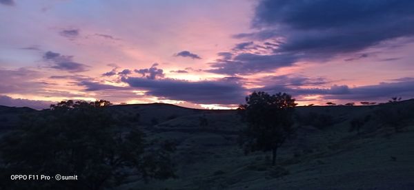 Scenic view of mountains against sky at sunset