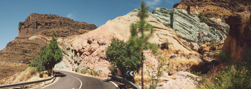 Empty road leading towards mountain