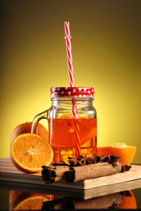 Close-up of orange juice on table