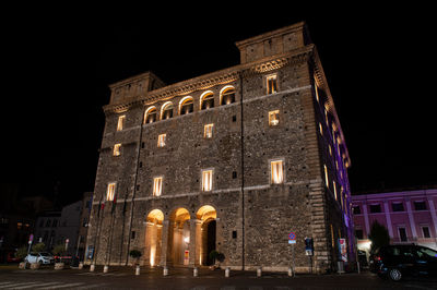 Low angle view of illuminated building at night