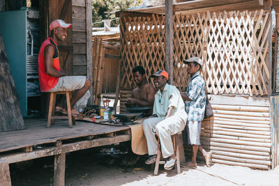 People sitting on wooden floor