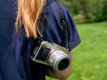 Close-up of woman photographing camera