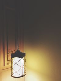 Illuminated light against wall