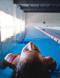 Portrait of woman swimming in pool