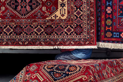 Rear view of child on tiled floor