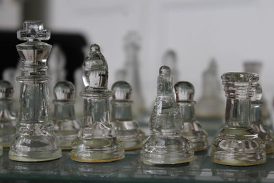 Close-up of chess pieces on table