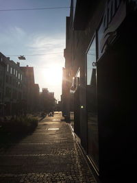 Street amidst city against sky