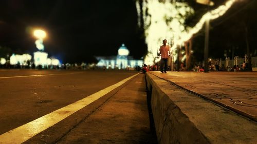 Illuminated street lights at night