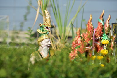 Statues amidst plants