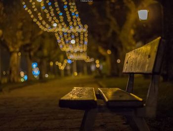 Illuminated lamp post at night