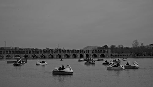 Group of people on boats in lake