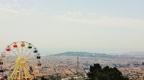 View of ferris wheel in city