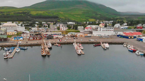 High angle view of harbor by sea against sky