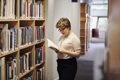 Young female student in library