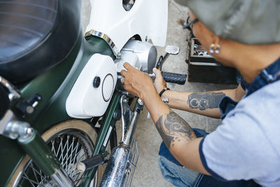 High angel view of mechanic working in garage