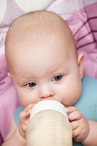 Close-up of cute baby boy eating food