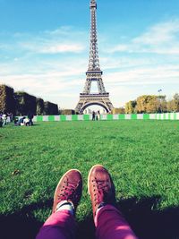 Low section of people relaxing on grassy field