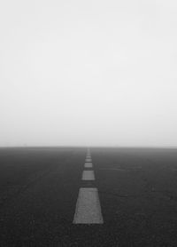 Empty road against clear sky