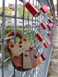 Close-up of padlocks on railing