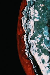 Close-up of ice cream over black background