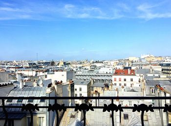 Cityscape against blue sky