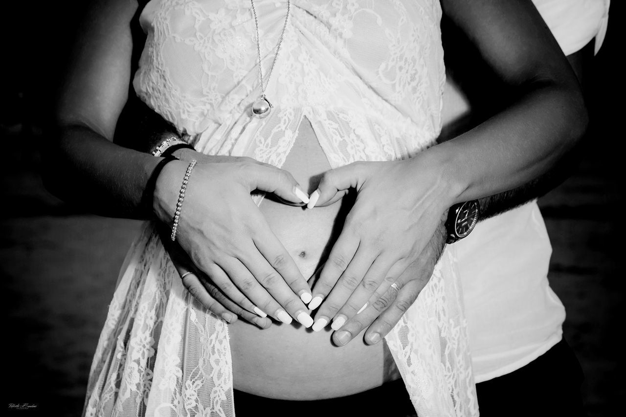 midsection, women, love, hand, adult, human hand, real people, positive emotion, human body part, people, bonding, bride, two people, human abdomen, anticipation, couple - relationship, front view, togetherness, pregnant, lifestyles, body part